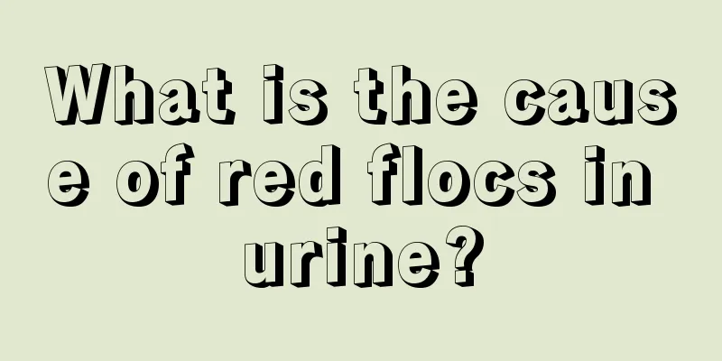 What is the cause of red flocs in urine?